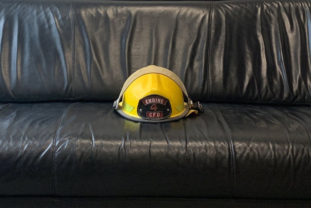 Firefighter Helmet on Couch. Therapy for 1st responders.